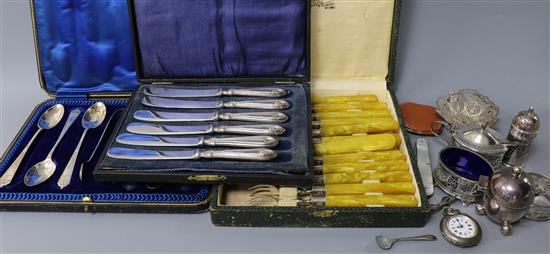 A cased set of six silver teaspoons with tongs, a silver three piece condiment set and other items.